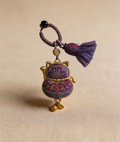 Purple Maneki Neko Lucky Charm from JOFAE Kyoto, handcrafted Japanese amulet symbolizing protection, wisdom, and inner balance.