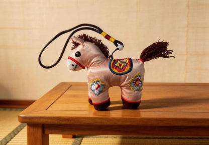 Pink Lucky Horse Charm by JOFAE Kyoto, handcrafted amulet symbolizing love, kindness, and emotional warmth, inspired by Kyoto craft.