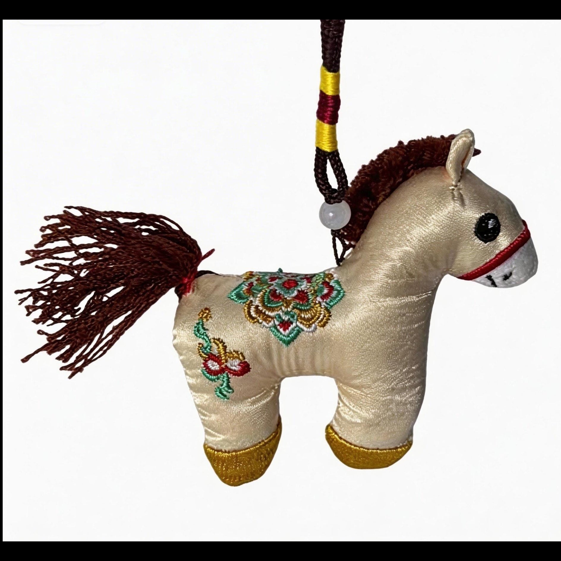 Hand-embroidered ivory Lucky Horse Charm by JOFAE Kyoto, a traditional Japanese amulet symbolizing safe journey and protection.