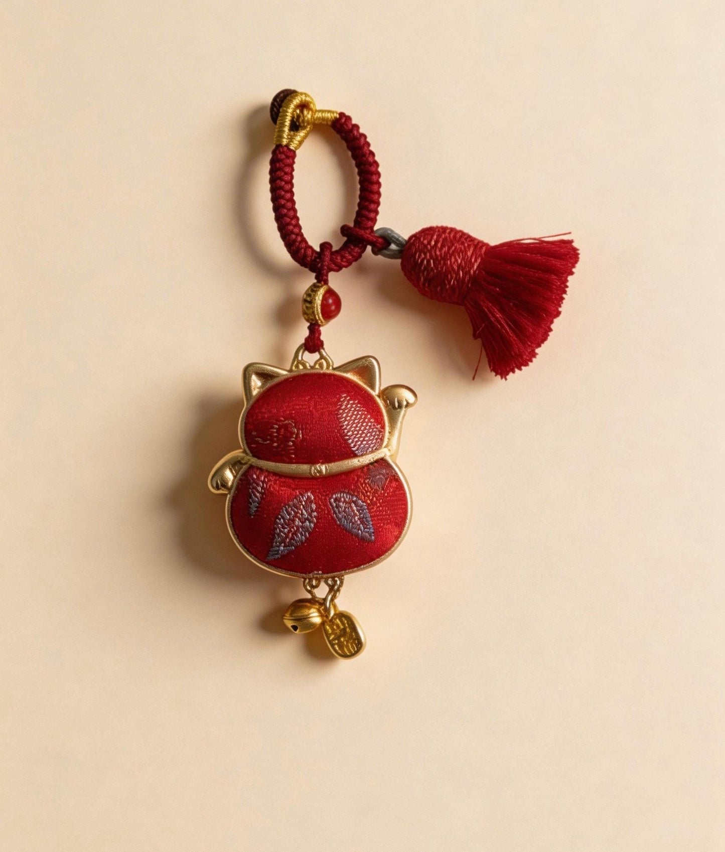 Red Maneki Neko lucky charm by JOFAE Kyoto, traditional Japanese handmade amulet symbolizing wealth, prosperity, and good fortune.