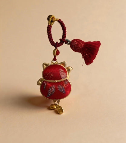 Red Maneki Neko Lucky Charm from JOFAE Kyoto, traditional Japanese handmade amulet symbolizing wealth, prosperity, and good fortune.