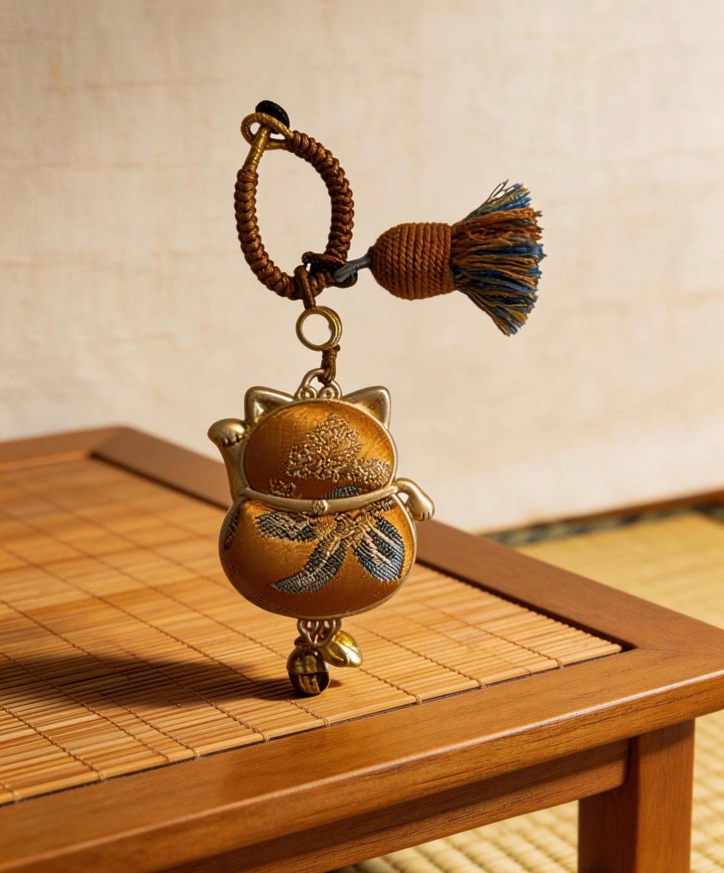 Yellow Maneki Neko lucky charm by JOFAE Kyoto, handmade cat amulet symbolizing wealth, success, and abundance.