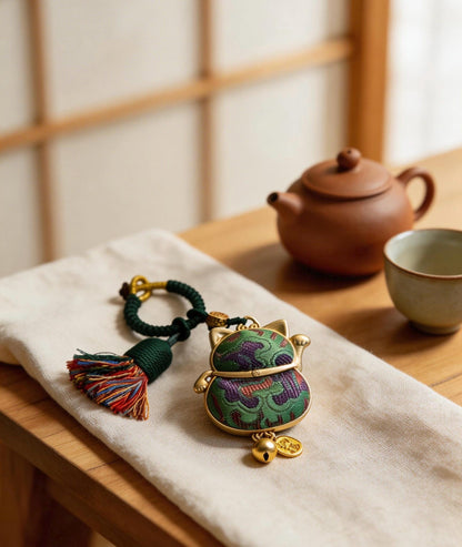 Green Maneki Neko lucky charm by JOFAE Kyoto, traditional Japanese handcrafted amulet symbolizing good luck, harmony, and balance.