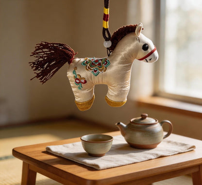 Kyoto-inspired handmade ivory Lucky Horse Charm by JOFAE Kyoto, featuring traditional Japanese embroidery symbolizing protection and safe journeys.