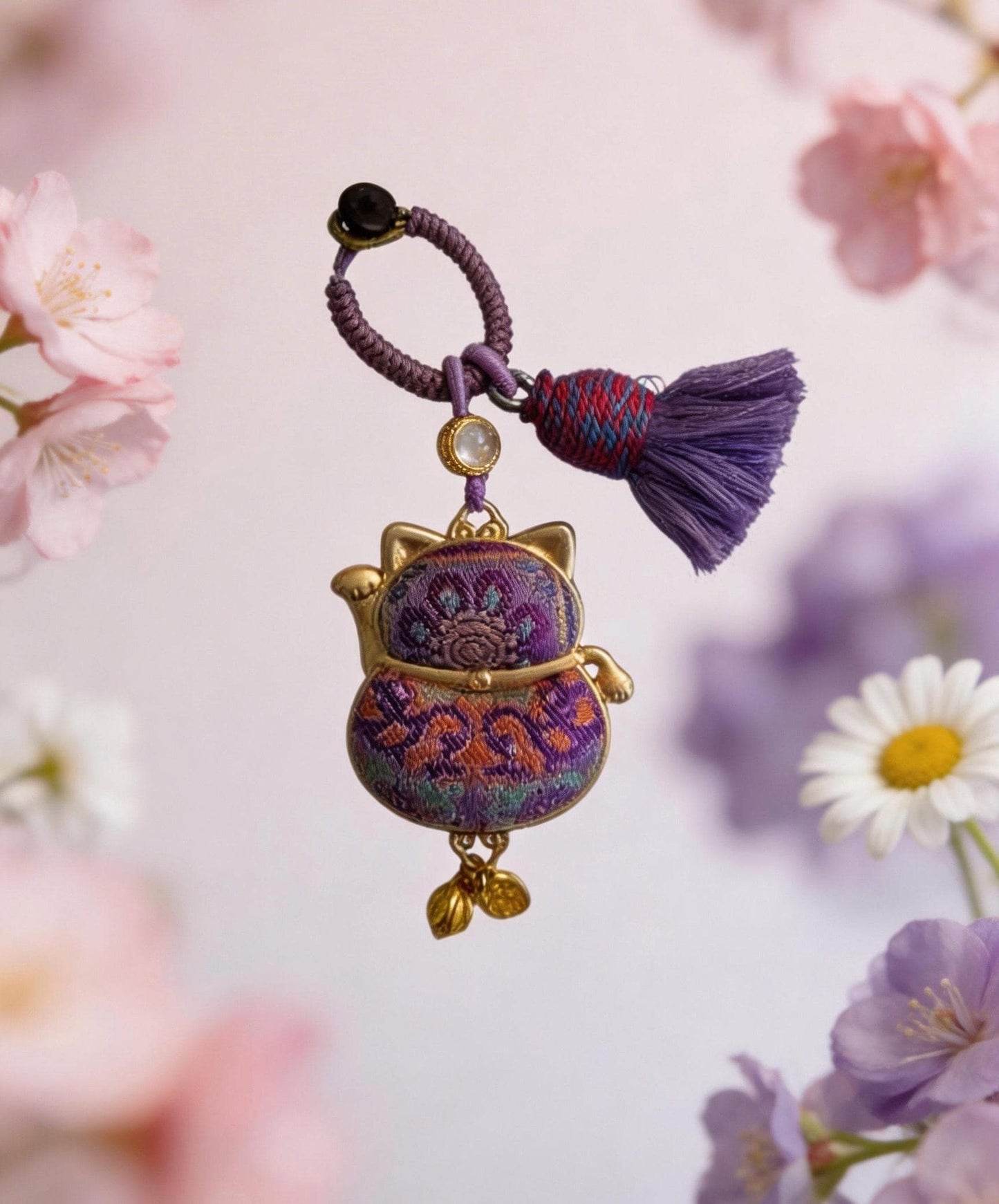 Purple Maneki Neko Lucky Charm by JOFAE Kyoto, handmade Japanese amulet symbolizing protection, wisdom, and inner balance.