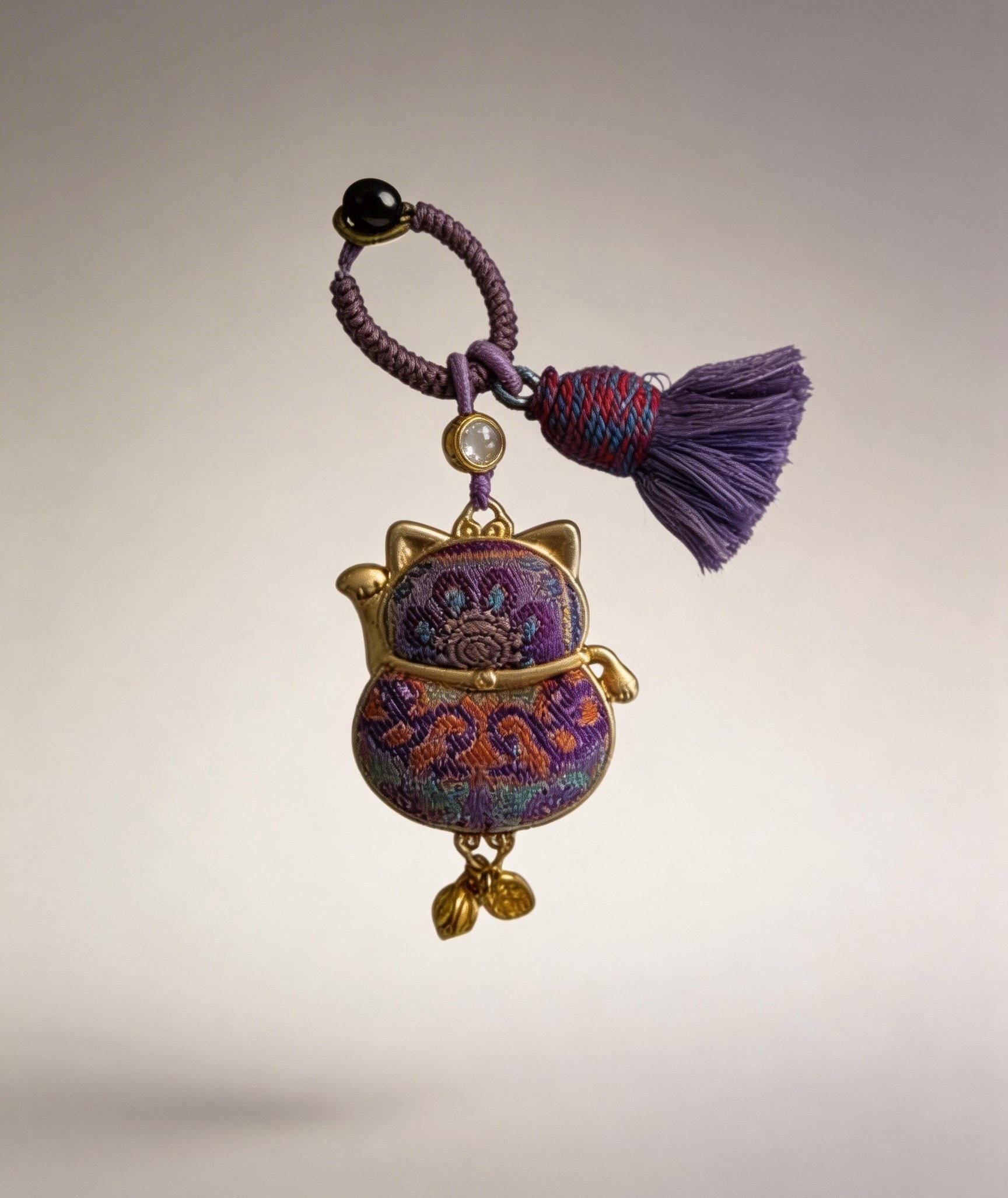 Purple Maneki Neko lucky charm by JOFAE Kyoto, handmade Japanese amulet symbolizing protection, wisdom, and inner balance.