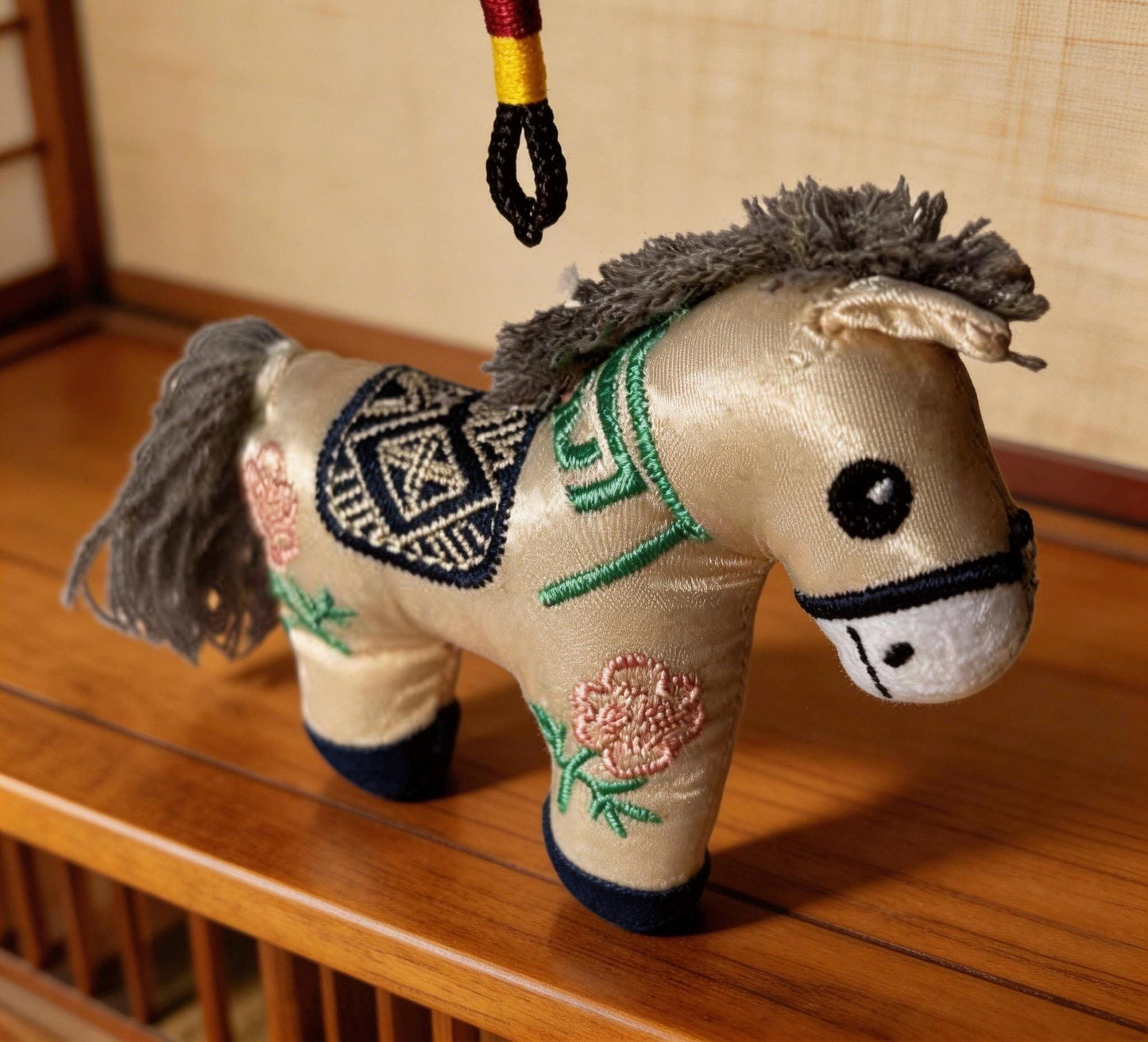 Blue Lucky Horse Charm by JOFAE Kyoto, a handmade Japanese amulet symbolizing travel protection and guidance.