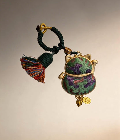 Green Maneki Neko lucky charm from JOFAE Kyoto, a traditional Japanese handmade amulet symbolizing good luck, harmony, and balance.