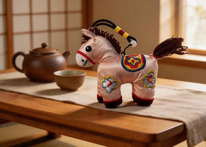 Pink Lucky Horse Charm by JOFAE Kyoto, handmade amulet symbolizing love, kindness, and emotional warmth in artisan Kyoto craft style.