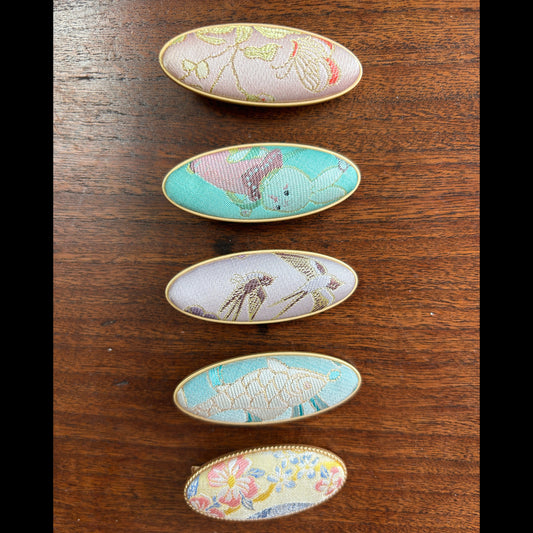 JOFAE Kyoto handmade brocade oval clip with intricate pattern, showcasing quiet luxury style in elegant fabric and craftsmanship.