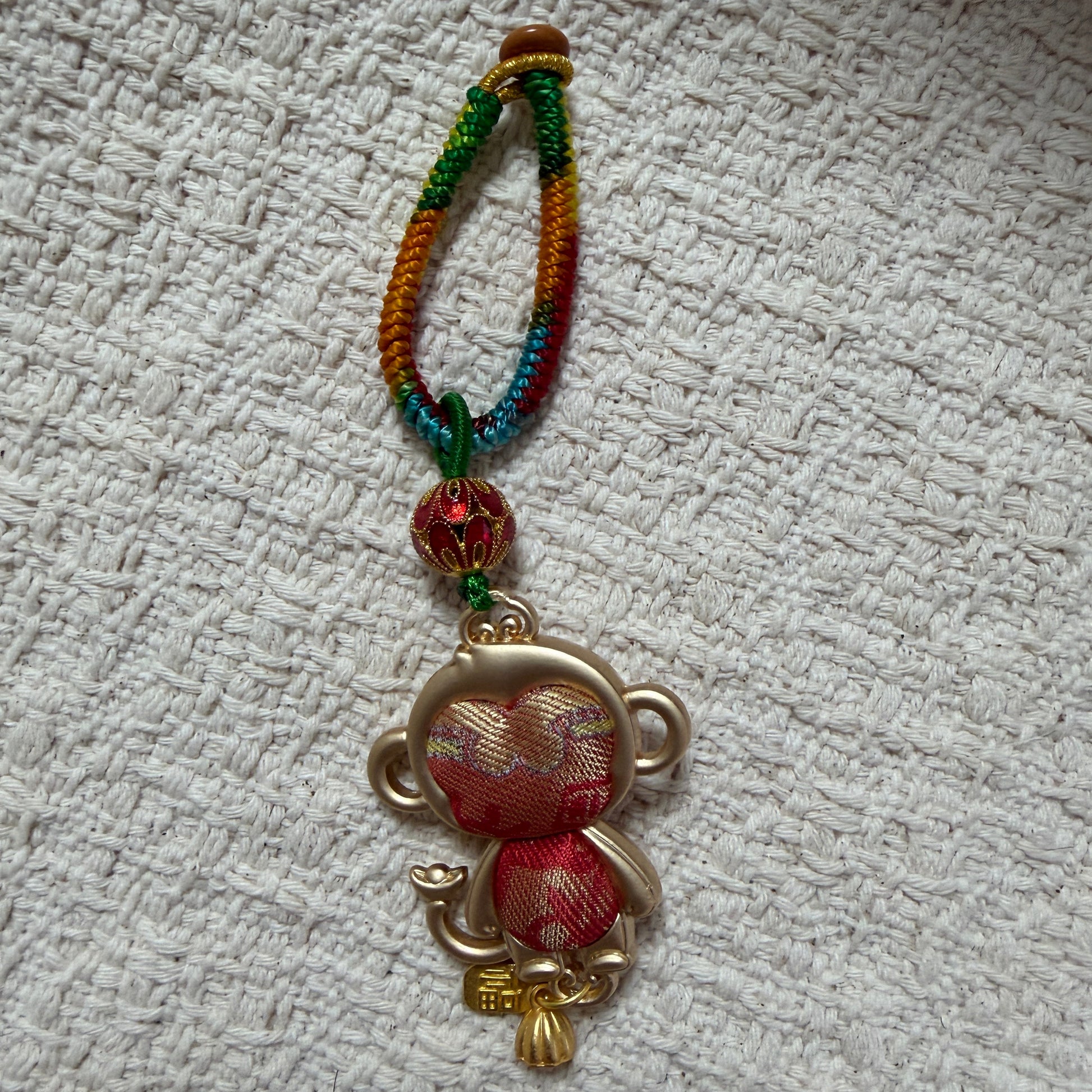 JOFAE Kyoto handmade monkey zodiac keychain with intricate details, serving as a lucky charm for intelligence, joy, and creativity.