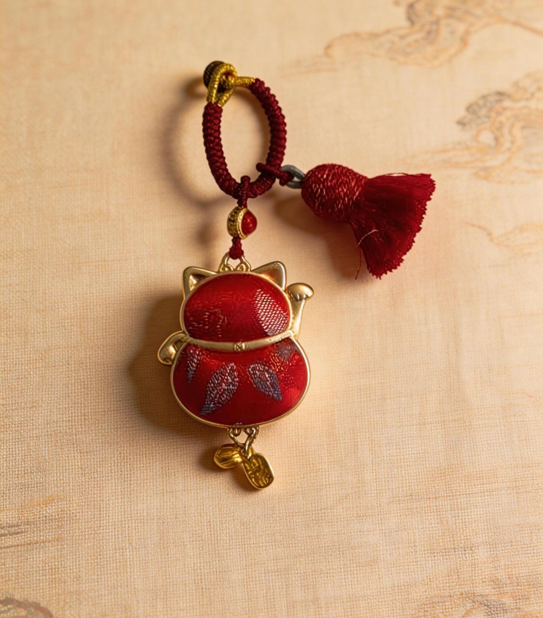 Red Maneki Neko Lucky Charm by JOFAE Kyoto, traditional Japanese handmade amulet symbolizing wealth, prosperity, and good fortune.