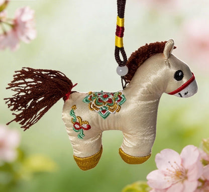 Ivory Lucky Horse Charm from JOFAE Kyoto, handcrafted Japanese amulet featuring embroidery, symbolizing safe journey and protection.