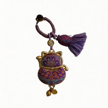Purple Maneki Neko Lucky Charm by JOFAE Kyoto, a handmade Japanese amulet symbolizing protection, wisdom, and inner balance.