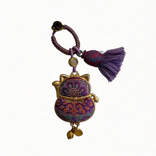 Purple Maneki Neko Lucky Charm by JOFAE Kyoto, a handmade Japanese amulet symbolizing protection, wisdom, and inner balance.
