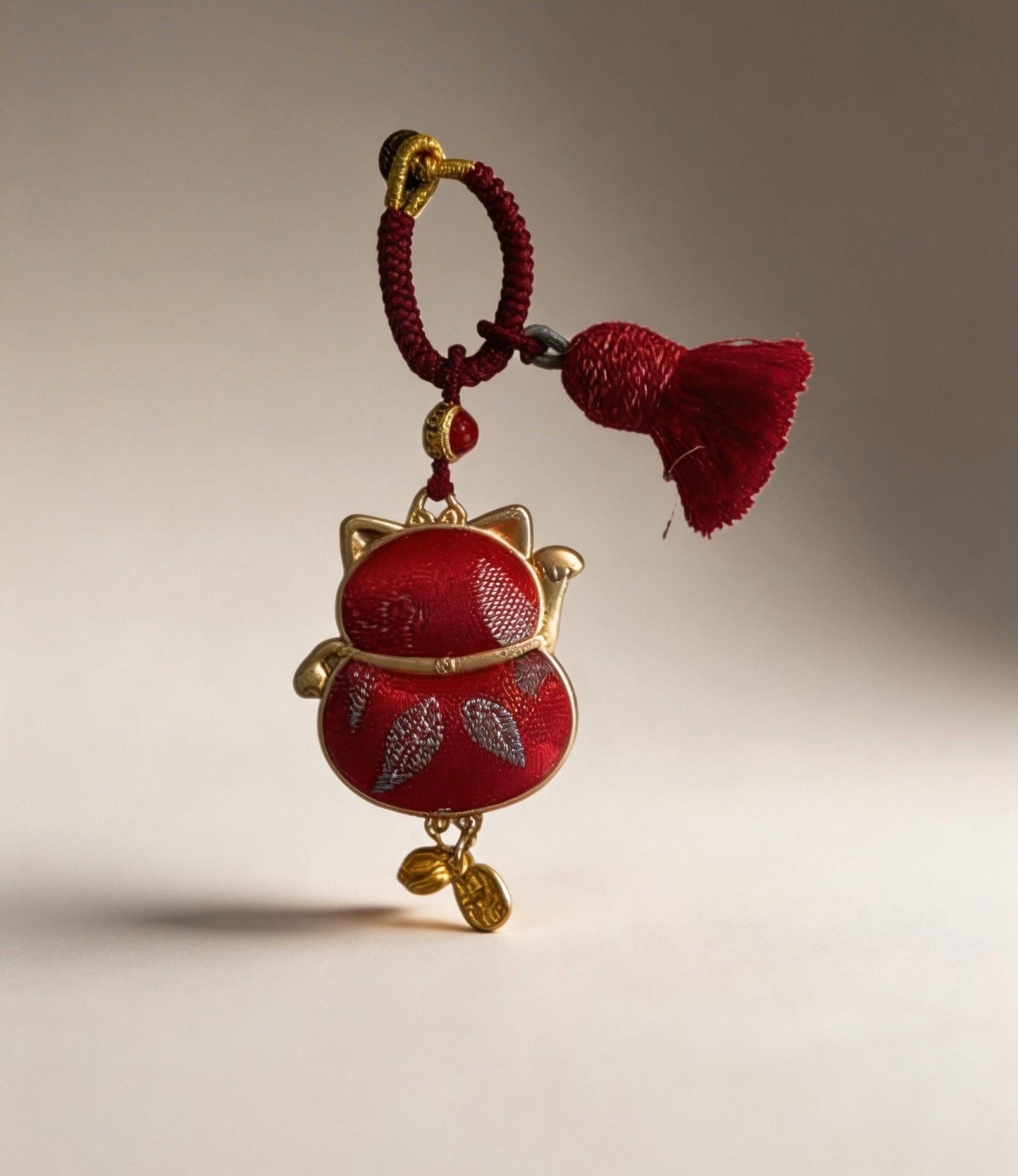 Red Maneki Neko Lucky Charm by JOFAE Kyoto, traditional Japanese handmade amulet symbolizing wealth, prosperity, and good fortune.