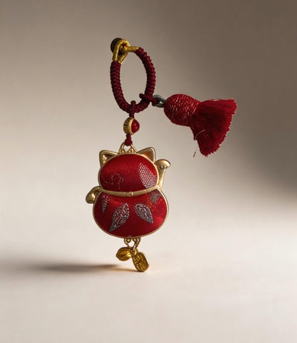 Red Maneki Neko Lucky Charm by JOFAE Kyoto, traditional Japanese handmade amulet symbolizing wealth, prosperity, and good fortune.