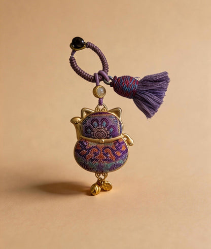 Purple Maneki Neko Lucky Charm by JOFAE Kyoto, handmade Japanese amulet symbolizing protection, wisdom, and inner balance.
