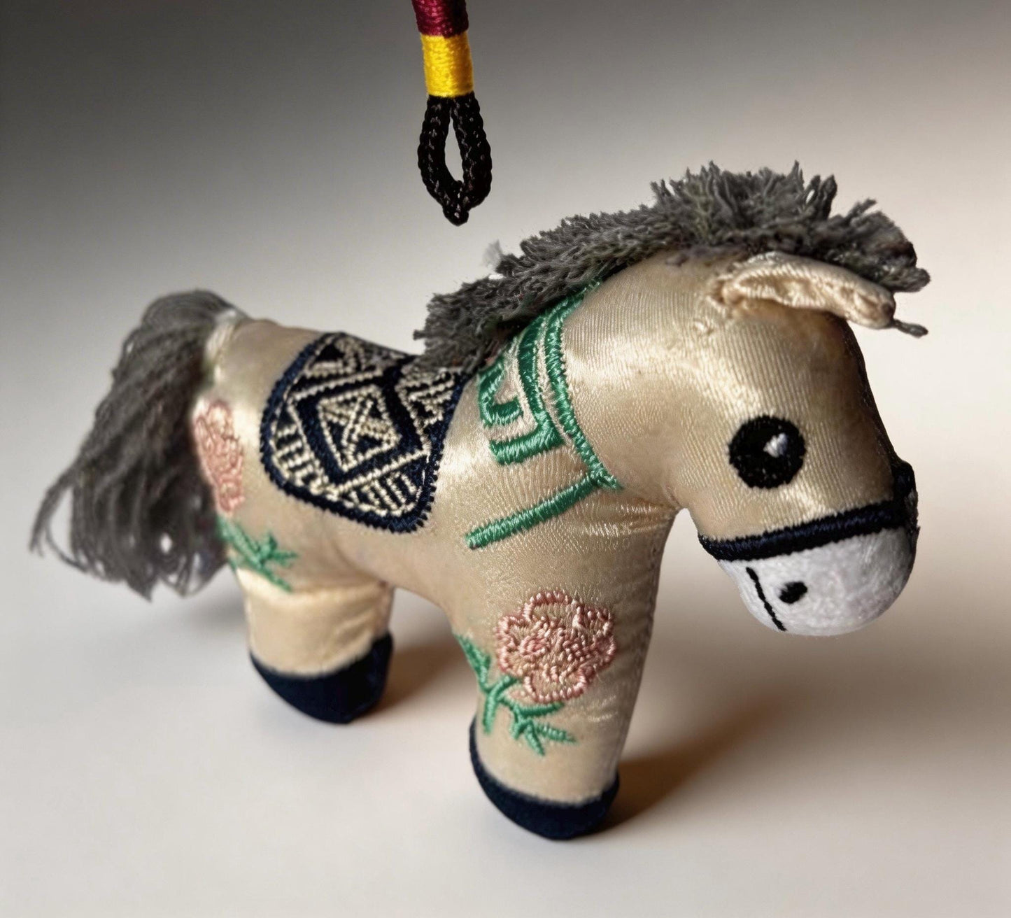 Blue Lucky Horse Charm from JOFAE Kyoto, handmade Japanese amulet with intricate details, symbolizing travel protection and guidance.