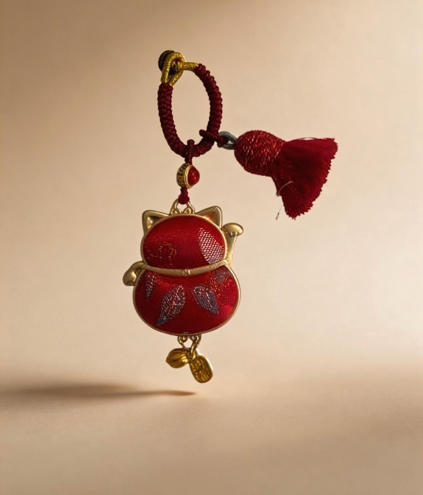 Red Maneki Neko Lucky Charm by JOFAE Kyoto, traditional Japanese handcrafted amulet symbolizing wealth, prosperity, and good fortune.
