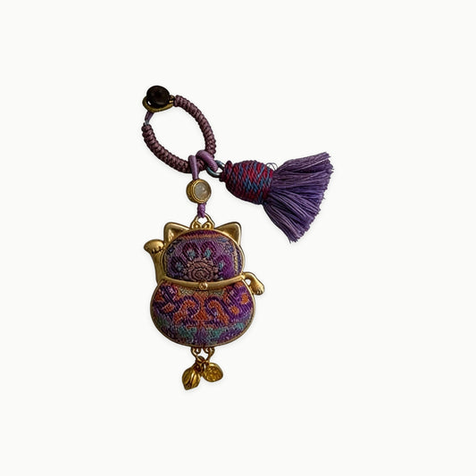 Maneki Neko Lucky Charm (Purple) – Kyoto Inspired Handmade Amulet – Symbol of Protection, Wisdom and Inner Balance – Artisan Japanese Craft - original product on a light background