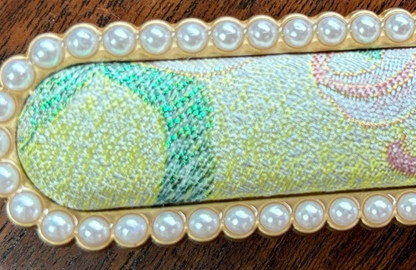 Close-up of the original brocade weave and pearl border